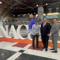 Cook County Assessor Fritz Kaegi (center) stands with Maricopa County Assessor Eddie Cook (left) and Philadelphia Chief Assessment Officer James “AJ” Aros (right) at the annual conference of the National Association of Counties, July 11, 2025.